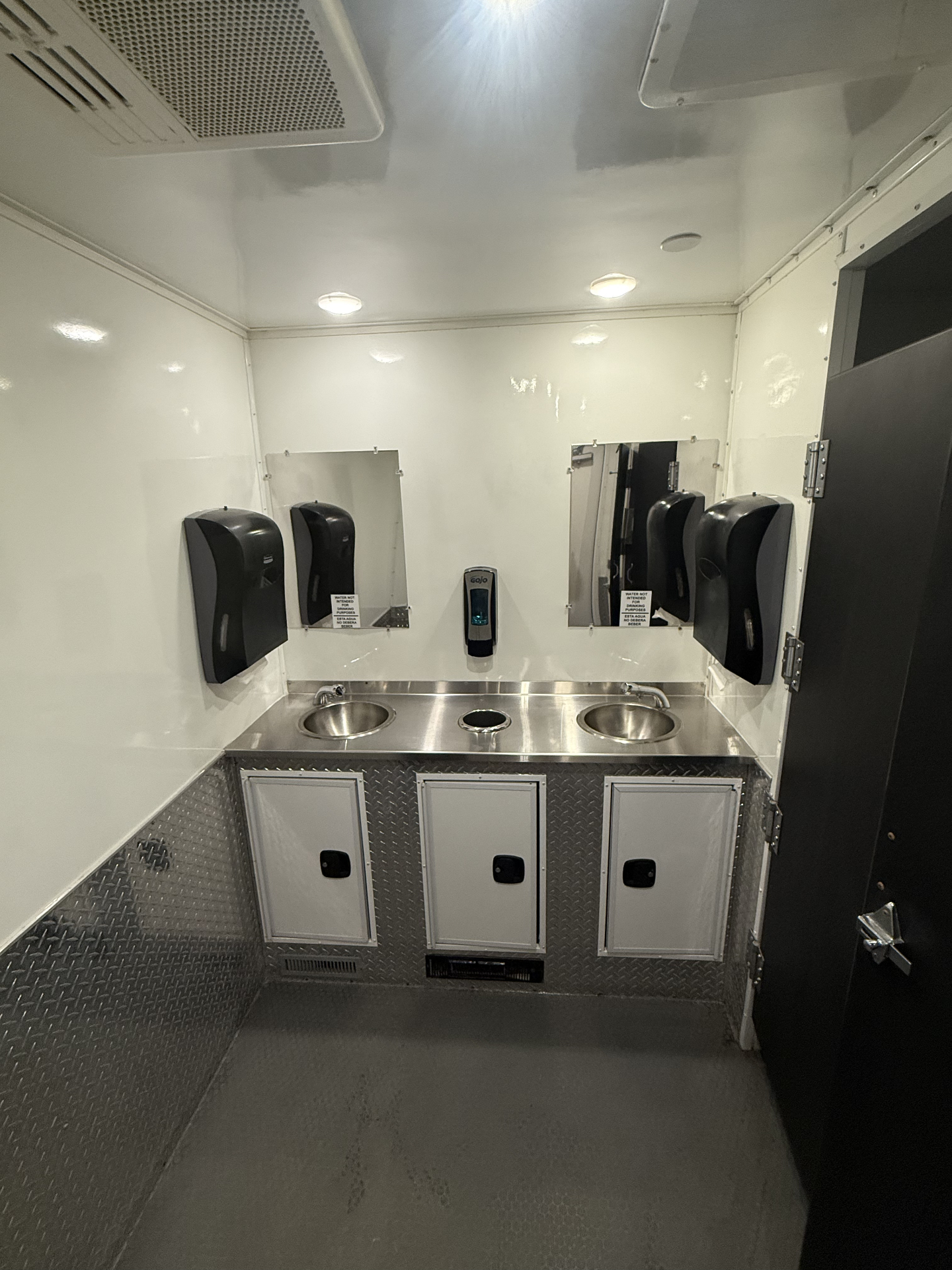 Interior sink station with vanity lighting
